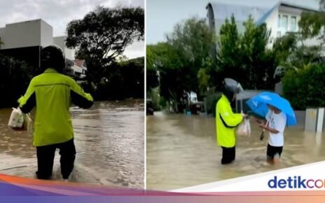 Demi Antar Makanan Pelanggan, Pengemudi Ojol Rela Terjang Banjir